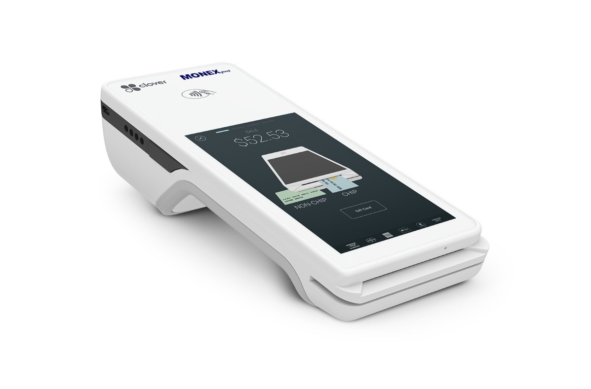 A boutique salesperson inserts the chip card into the Clover Flex POS terminal and hands it over to the customer.